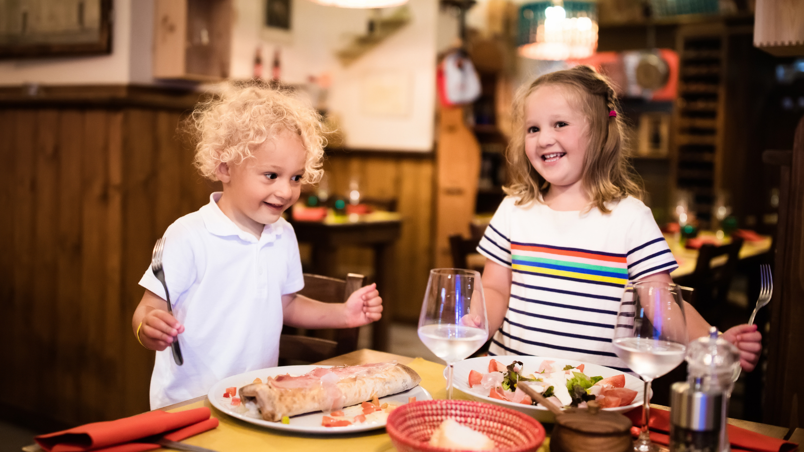 two children eating at a restaurant